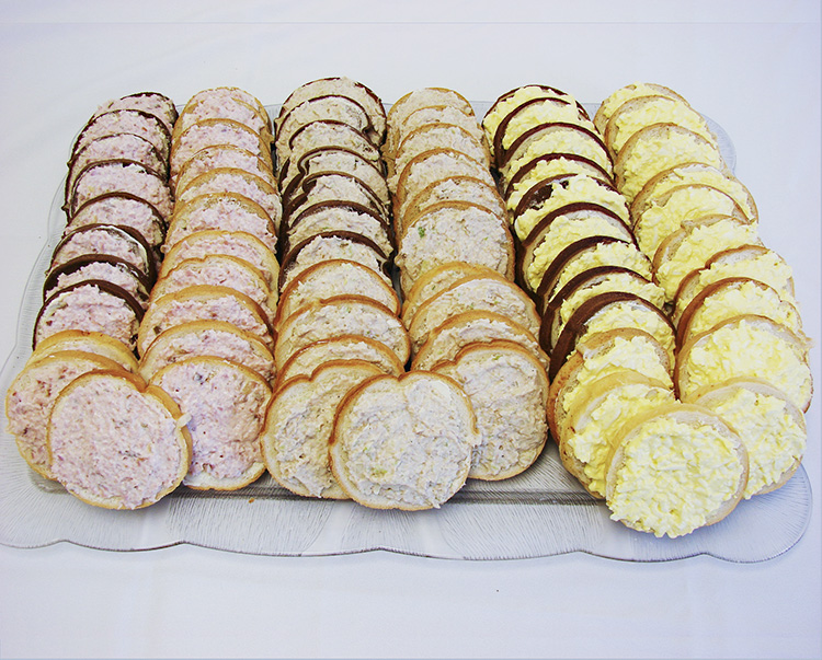 open-faced sandwiches on crimp bread